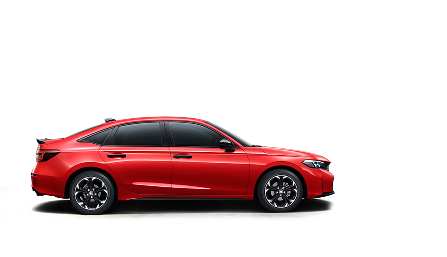 2026 Honda CIVIC in red, full right-side view against an urban street background