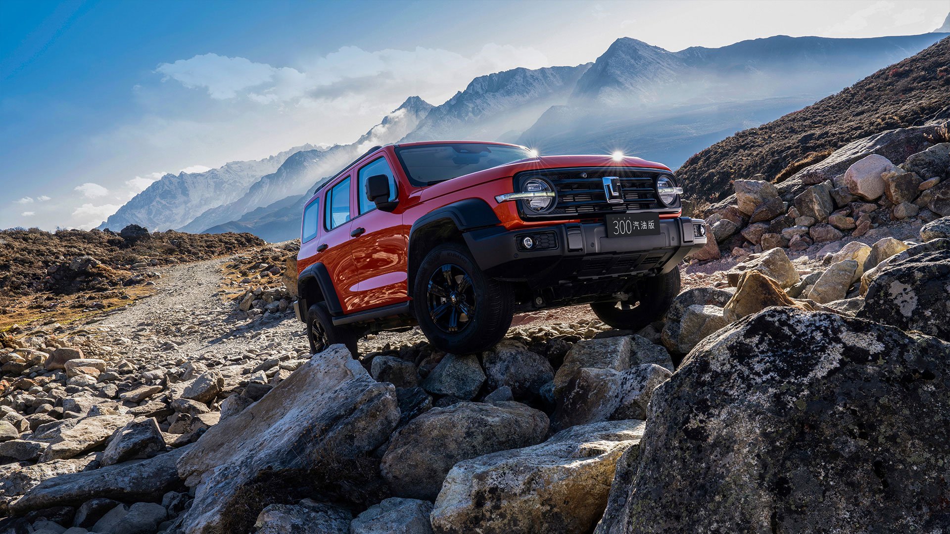 Red TANK 300 2025 SUV Front View on Mountainous Rocky Terrain
