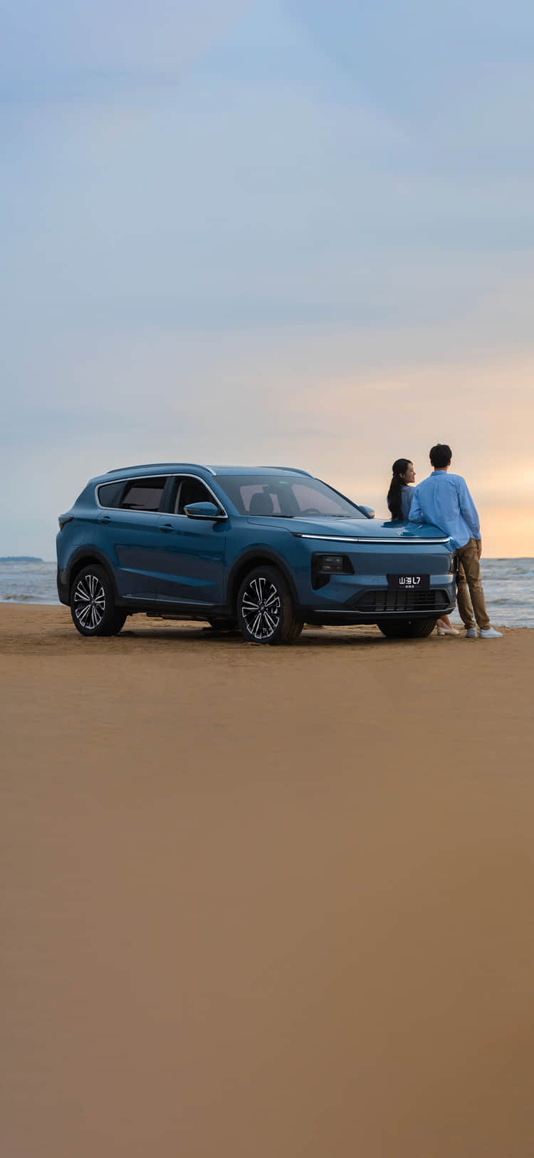 2026 Jetour Shanhai L7 in Blue parked on a beach with ocean backdrop.