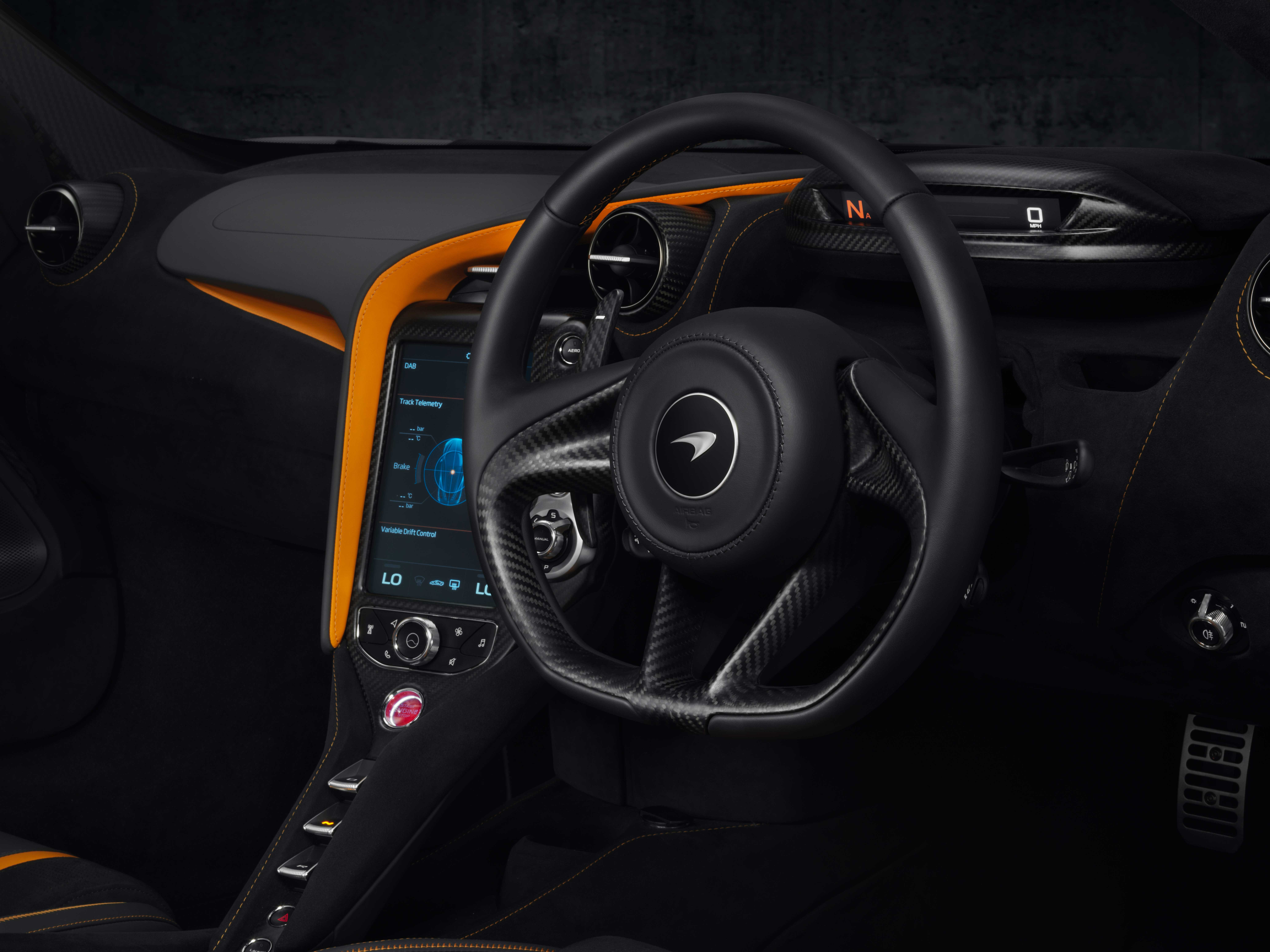 Interior detail of McLaren 720S, showcasing a perfect blend of black and orange