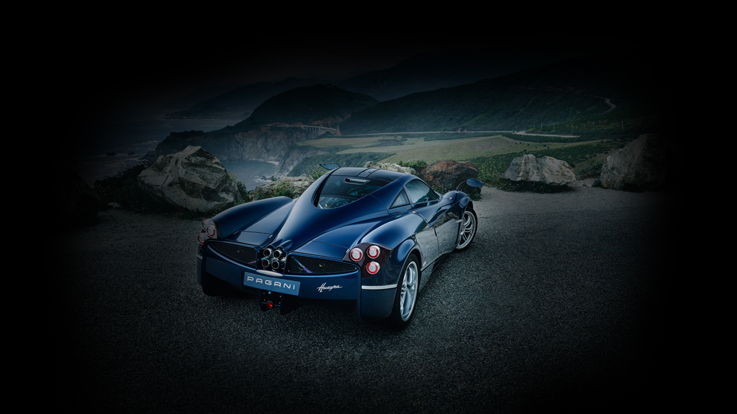 Quarter rear-right view of the 2011 Pagani Huayra Deepal against a mountain backdrop