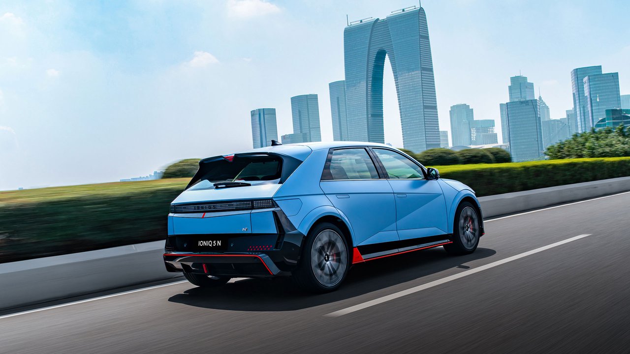 Right-side photo of the 2026 Hyundai IONIQ 5 N electric performance vehicle driving on an urban road